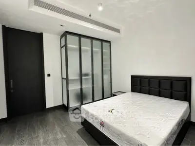 Modern minimalist bedroom with sleek design and ample storage space