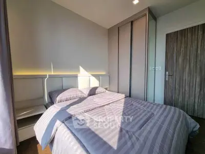 Modern bedroom with stylish decor and ample natural light