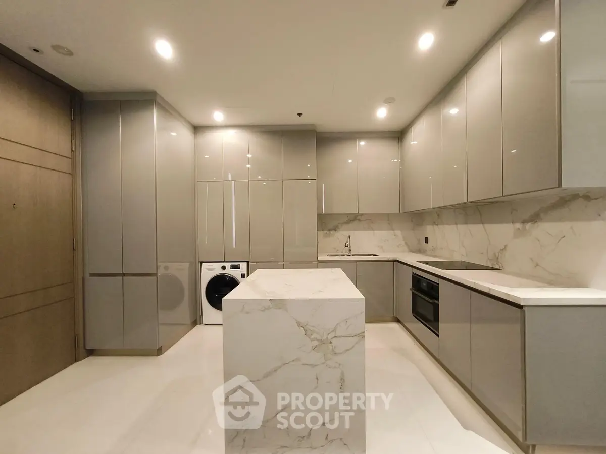 Luxurious modern kitchen with marble island and sleek cabinetry
