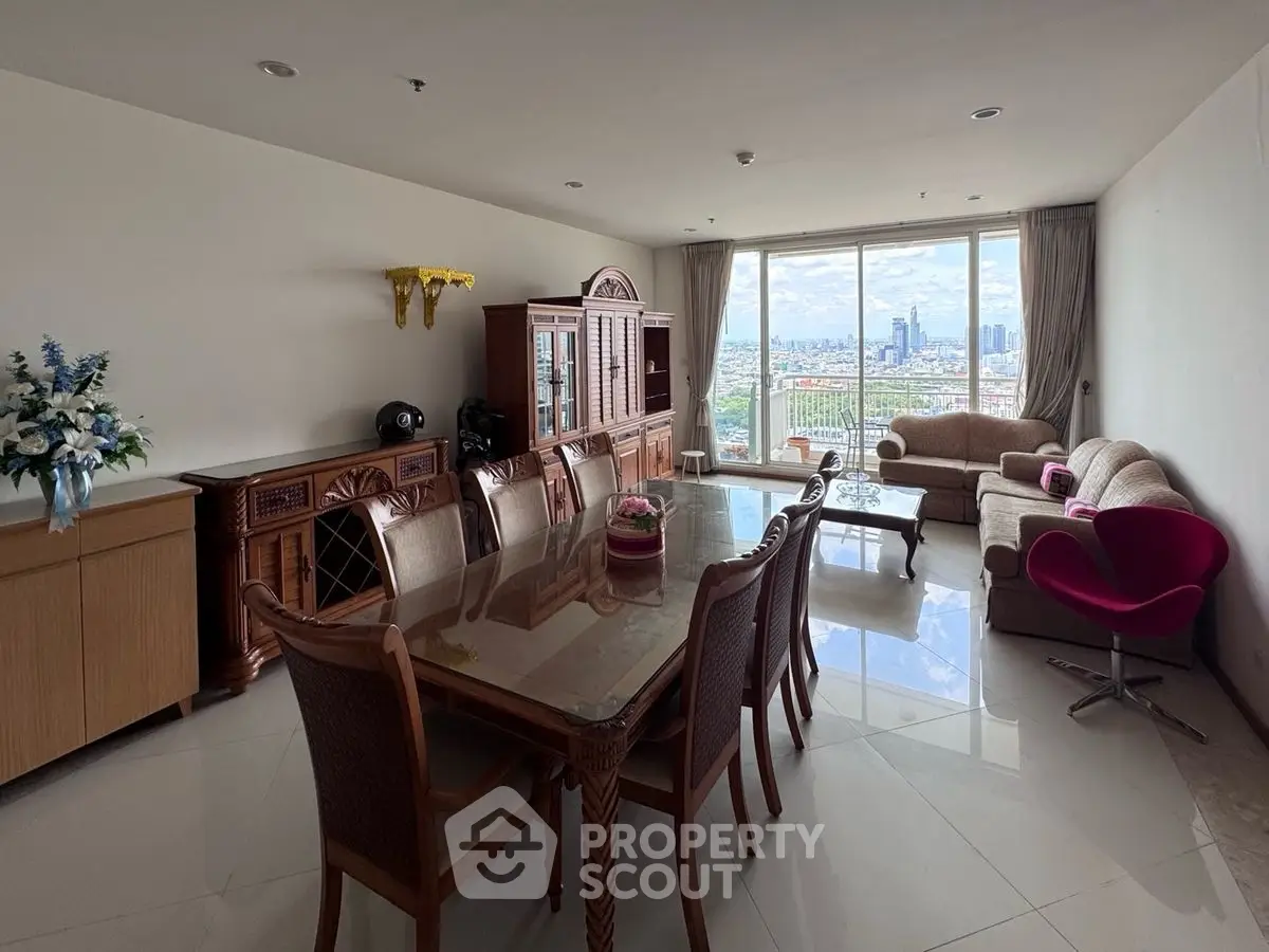 Spacious living room with elegant furniture and stunning city view.