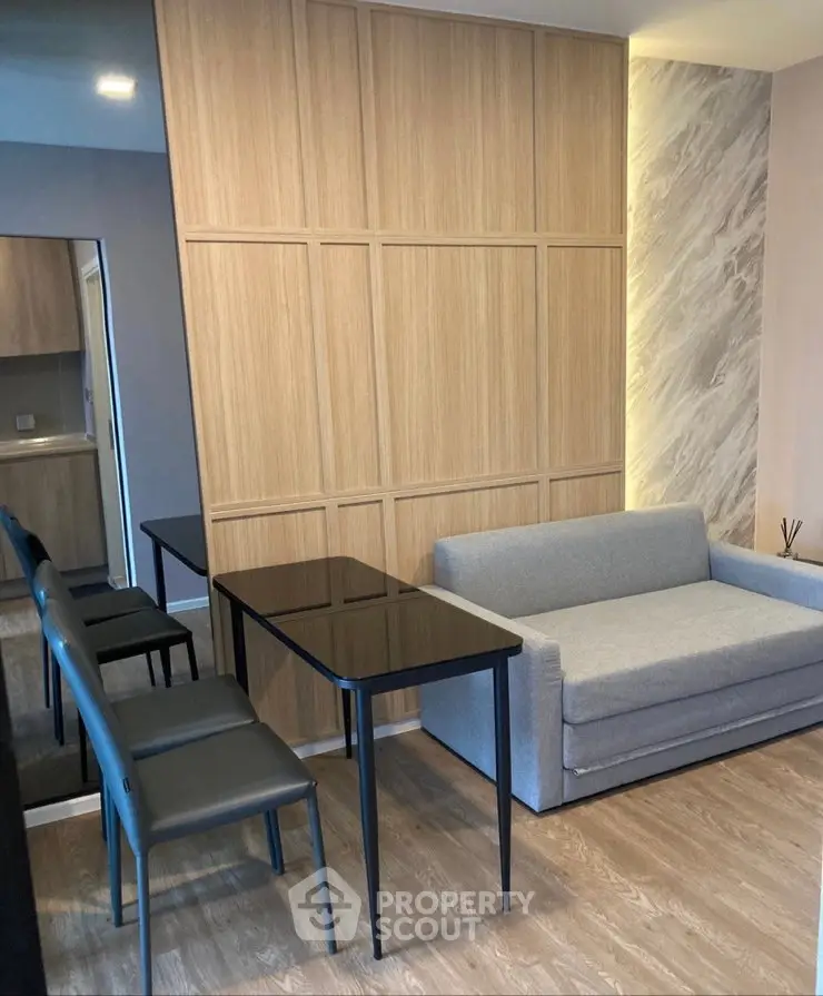 Modern living room with sleek furniture and elegant wood paneling