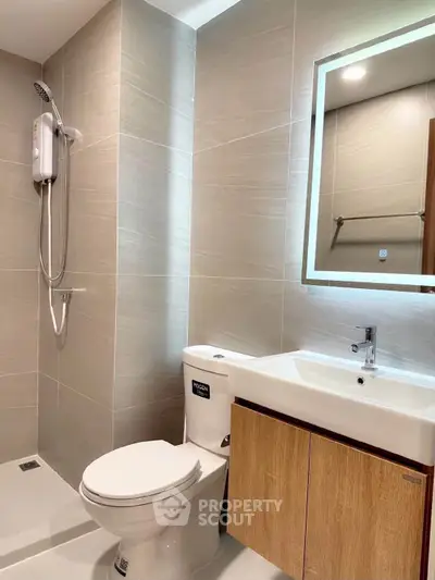 Modern bathroom with sleek fixtures and elegant lighting in a contemporary apartment.