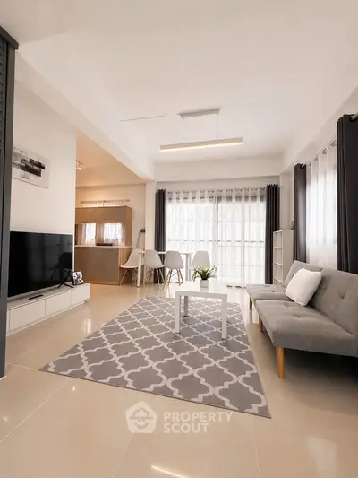 Spacious modern living room with stylish decor and natural light