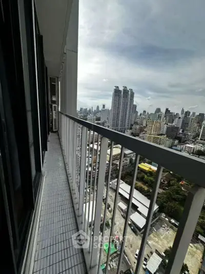 Stunning cityscape view from a high-rise balcony, perfect for urban living enthusiasts.