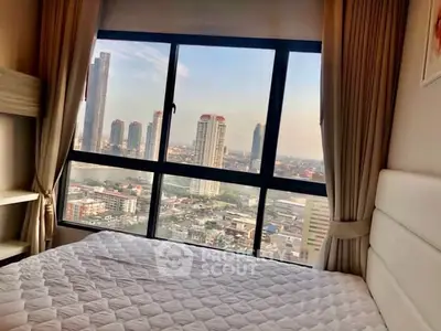 Stunning bedroom with panoramic city view from large window, modern decor and natural light.