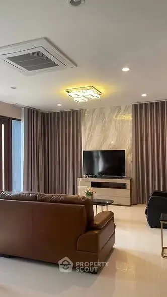 Luxurious living room with modern decor and elegant lighting