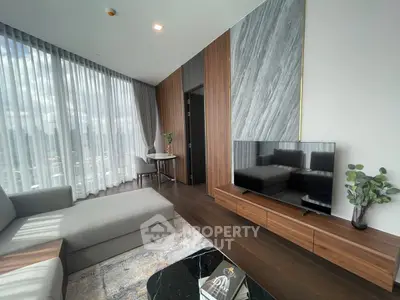 Luxurious modern living room with panoramic city view and elegant decor.