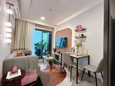 Modern living room with stylish decor and balcony view, perfect for urban living.