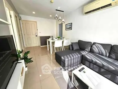 Modern living room with sleek furniture and air conditioning, perfect for comfortable living.