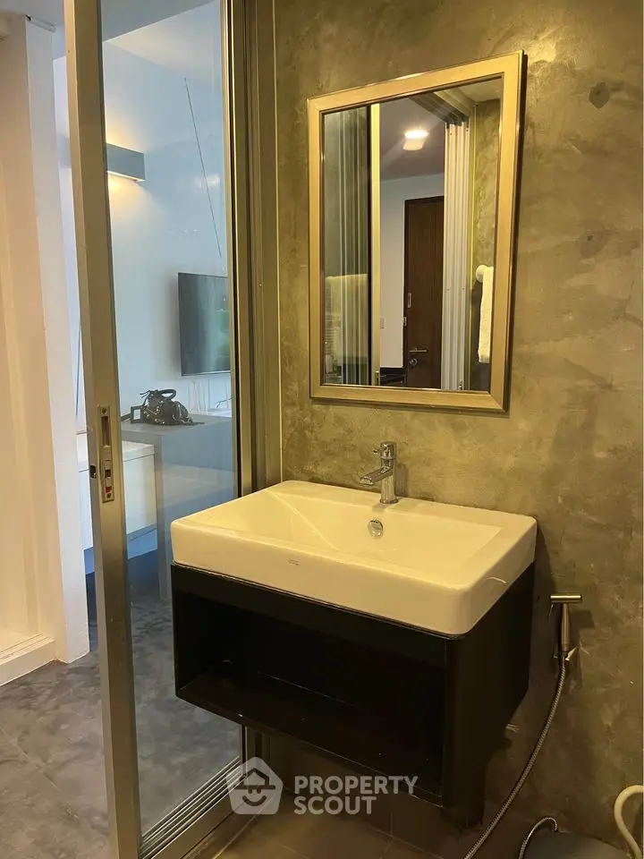 Modern bathroom with sleek sink and mirror in contemporary design