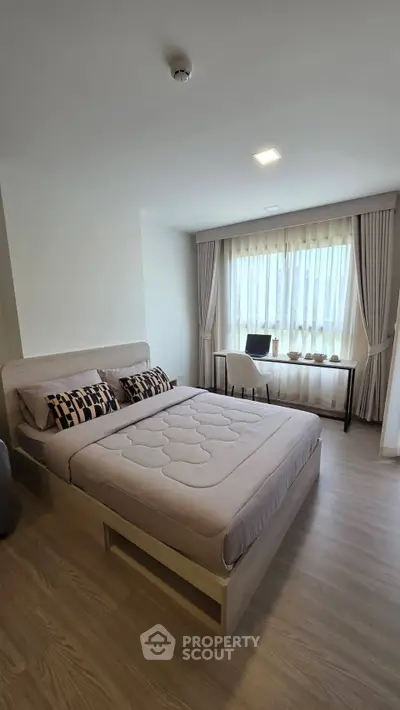 Modern bedroom with elegant decor and natural light