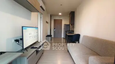 Modern living room with sleek furniture and open layout in a stylish apartment.