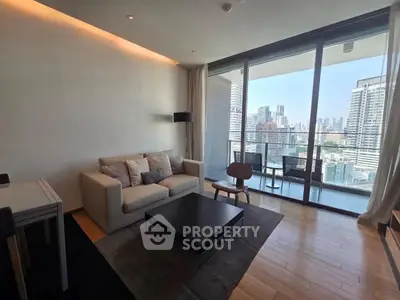 Modern living room with city view and spacious balcony in high-rise apartment