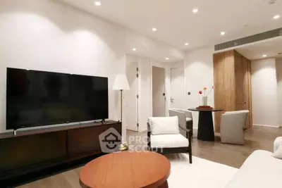 Modern living room with sleek furniture and ambient lighting, perfect for relaxation and entertainment.