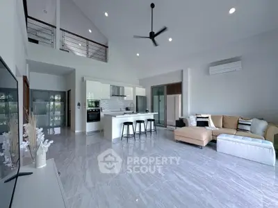 Spacious modern living room with open kitchen and stylish decor