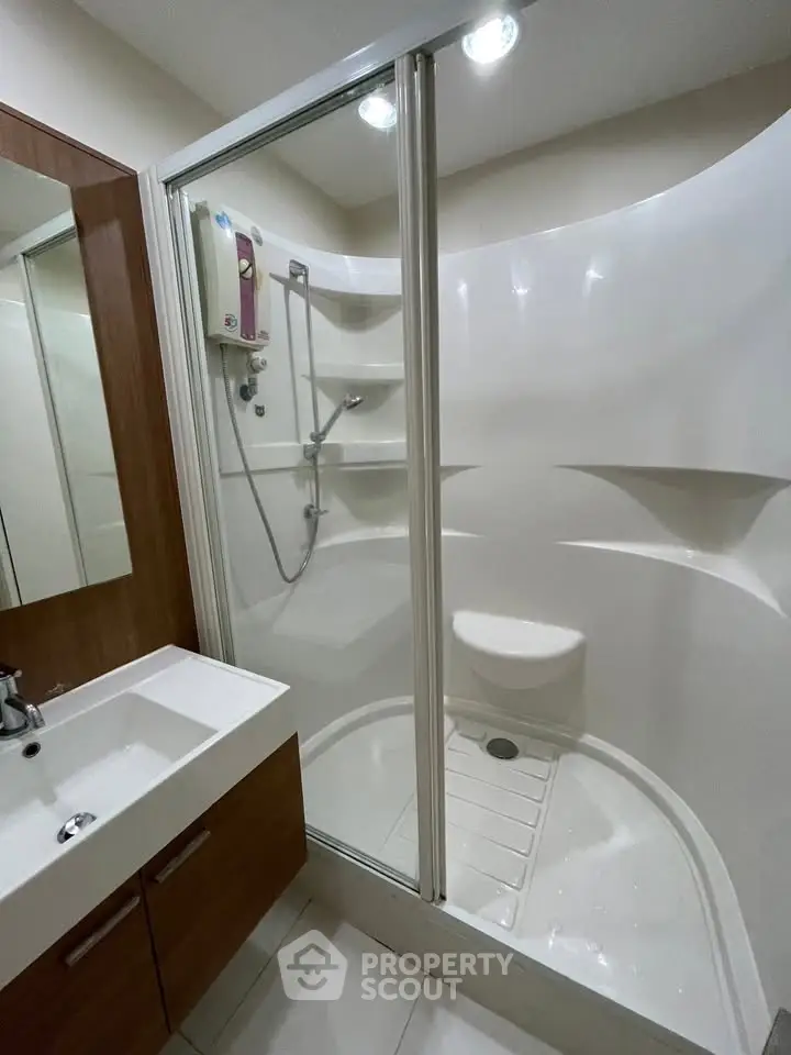 Modern bathroom with sleek shower cabin and stylish vanity unit