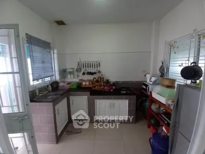Charming kitchen with closed layout and ample storage space