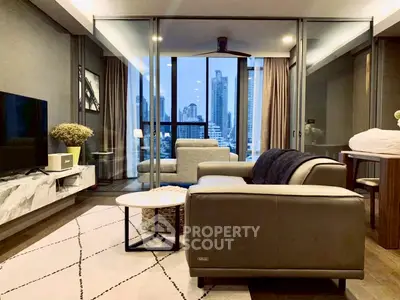 Luxurious living room with city view, modern furniture, and elegant decor in high-rise apartment.