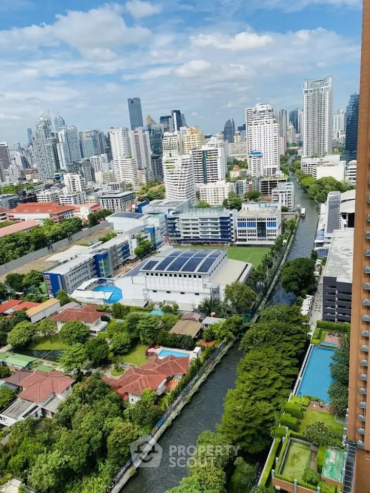 Stunning cityscape view with lush greenery and modern architecture, perfect for urban living enthusiasts.