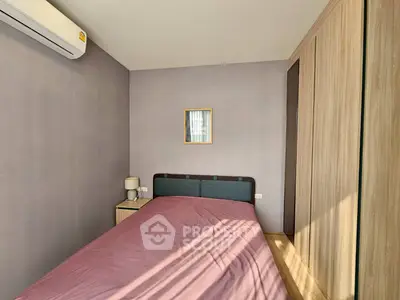 Cozy bedroom with modern air conditioning and ample wardrobe space