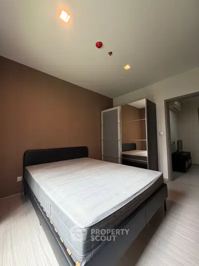 Modern bedroom with stylish bed and wardrobe in a cozy apartment