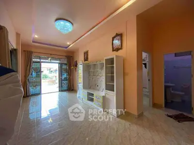 Spacious living room with elegant decor and large windows for natural light.