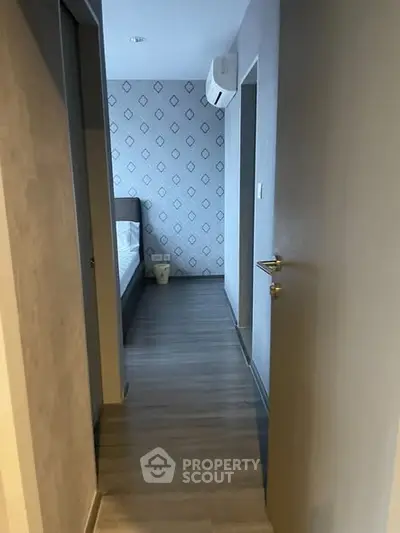 Modern bedroom entrance with stylish wallpaper and air conditioning