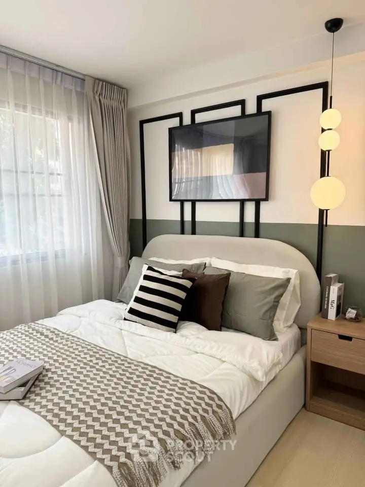Cozy bedroom with modern decor, featuring a stylish bed, elegant lighting, and a serene ambiance.