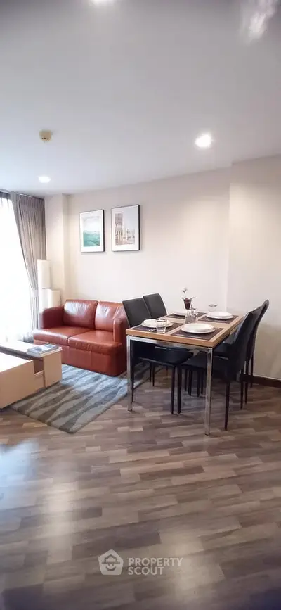 Modern living room with stylish furniture and dining area in open layout apartment