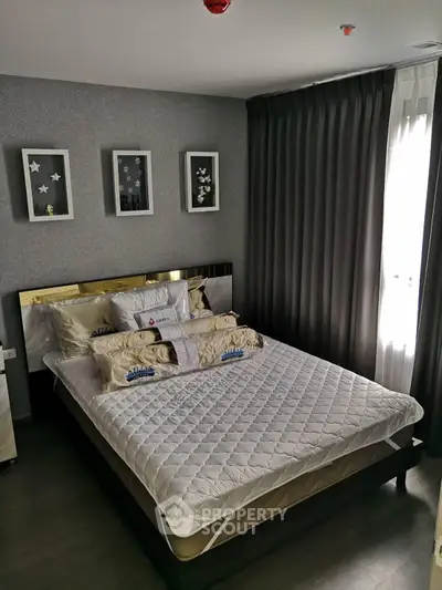 Cozy bedroom with modern decor and ample natural light