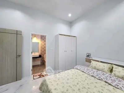Modern bedroom with ensuite bathroom and stylish decor