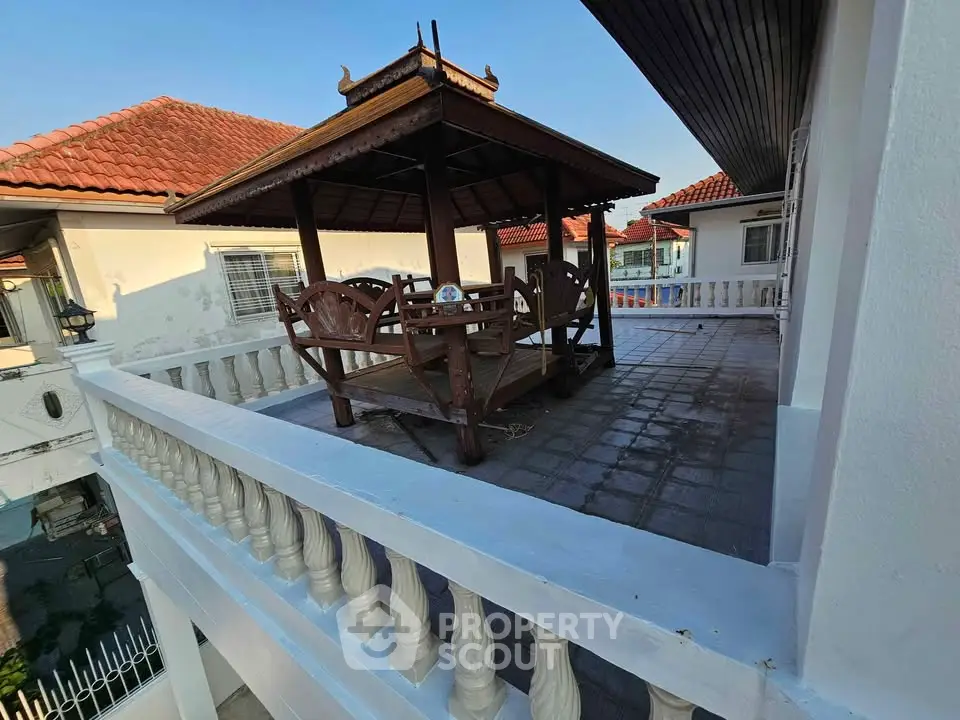 Charming rooftop terrace with traditional wooden gazebo and scenic views, perfect for relaxation and outdoor gatherings.