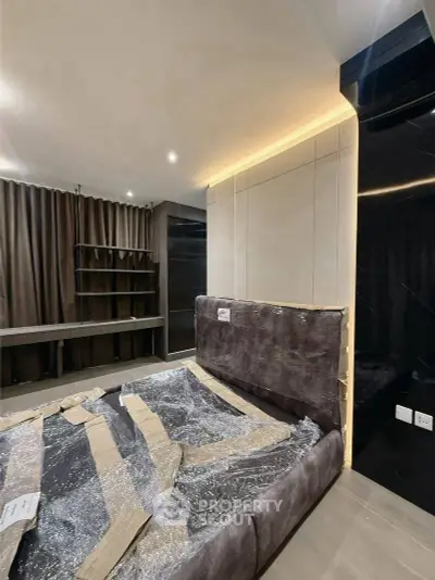 Modern bedroom with sleek design and ambient lighting