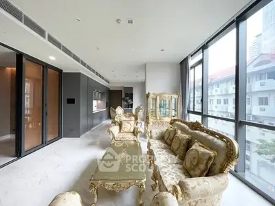 Luxurious living room with elegant furniture and large windows offering city views.
