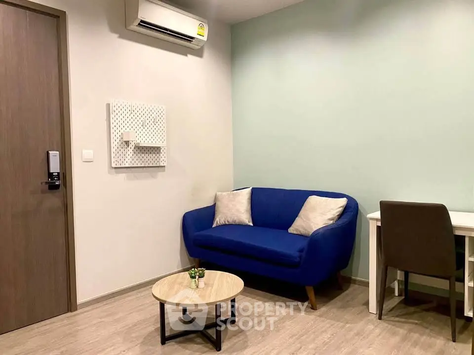 Cozy living room with blue sofa and modern decor