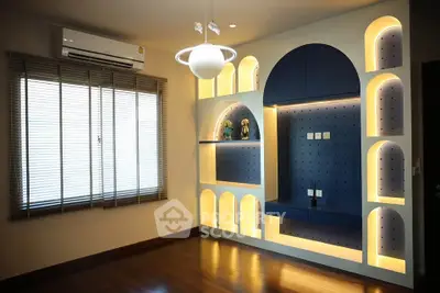 Modern living room with unique built-in shelving and ambient lighting