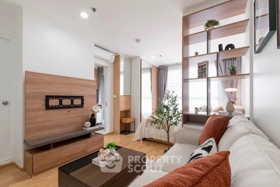 Modern open-plan living room with stylish decor and natural light