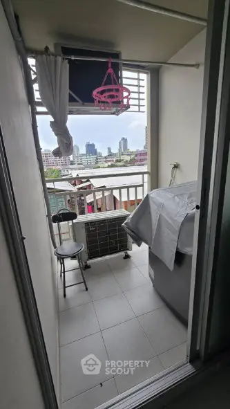 Cozy balcony with city view, perfect for relaxation and enjoying the skyline.