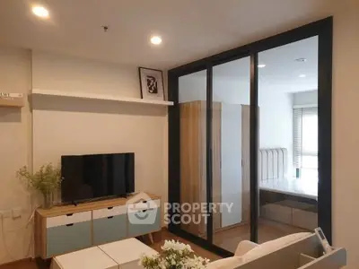 Modern living room with sliding glass doors and stylish furniture