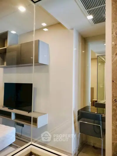 Modern living room with sleek TV setup and stylish furniture