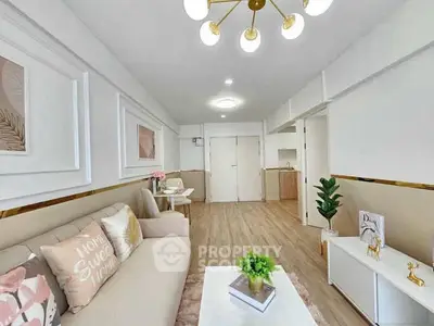 Stylish living room with modern decor and elegant lighting in a cozy apartment.