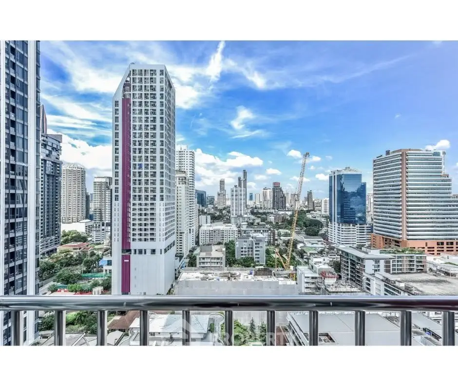 Stunning cityscape view from a high-rise balcony in a bustling urban area.