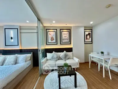 Modern studio apartment with stylish decor and cozy living area