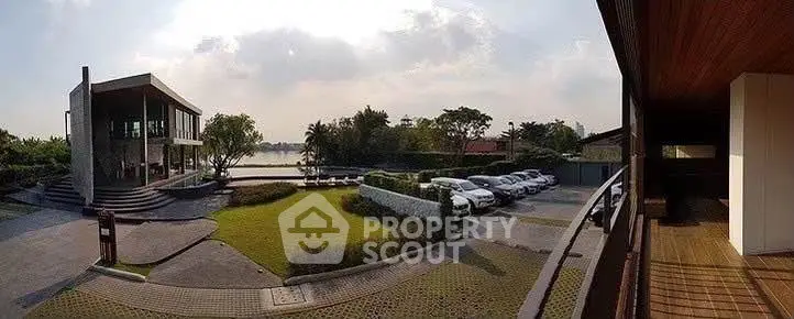 Stunning lakeside property with modern architecture and ample parking space.