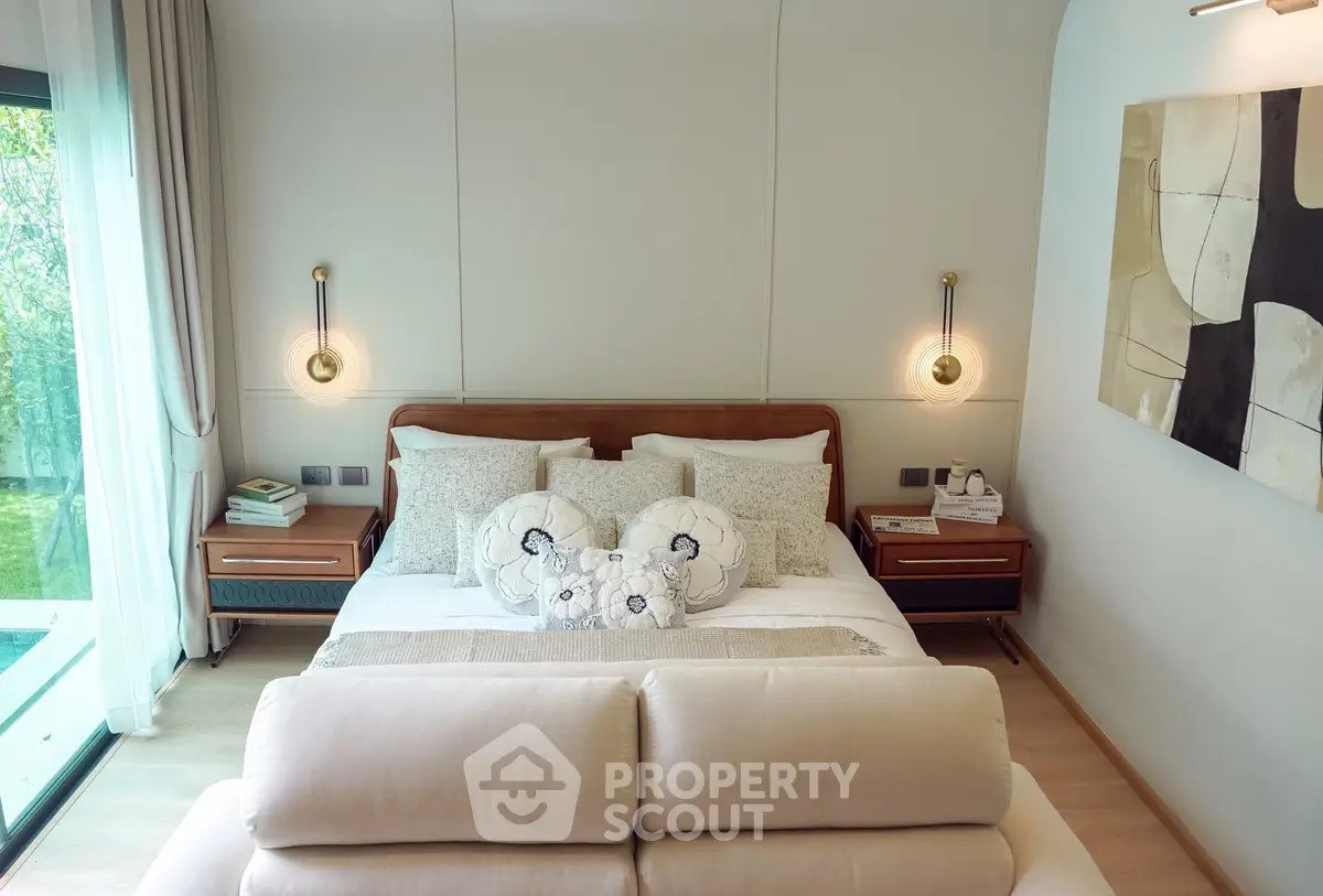 Luxurious bedroom with elegant decor and garden view, featuring modern lighting and cozy ambiance.