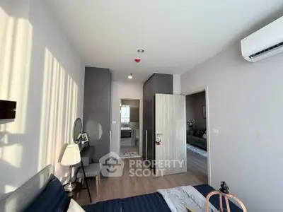 Modern bedroom with stylish decor and natural light