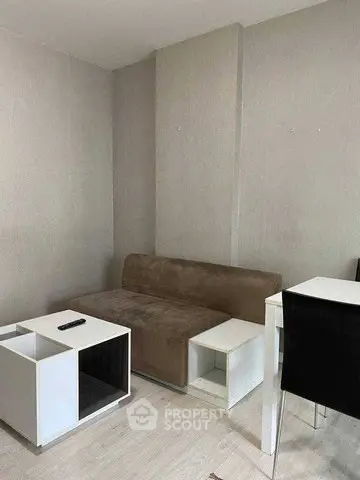 Cozy living room with modern furniture and neutral tones, perfect for relaxation and entertainment.