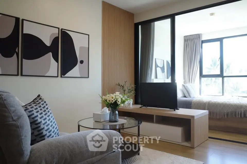 Modern living room with stylish decor and large window view