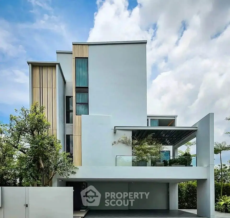 Modern architectural masterpiece with sleek design and lush greenery, perfect for luxury living.