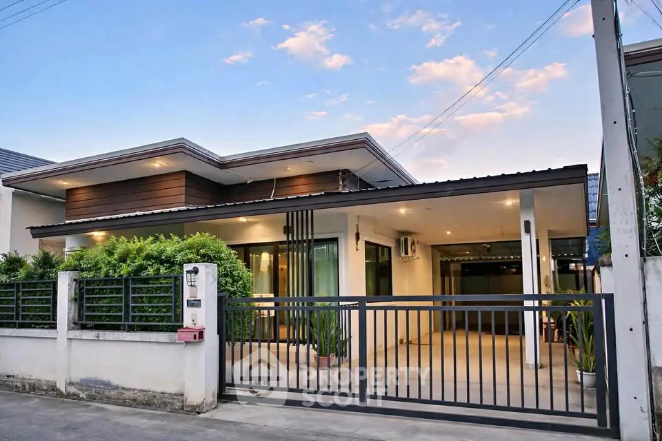 Modern single-story house with sleek design and spacious driveway in a serene neighborhood.